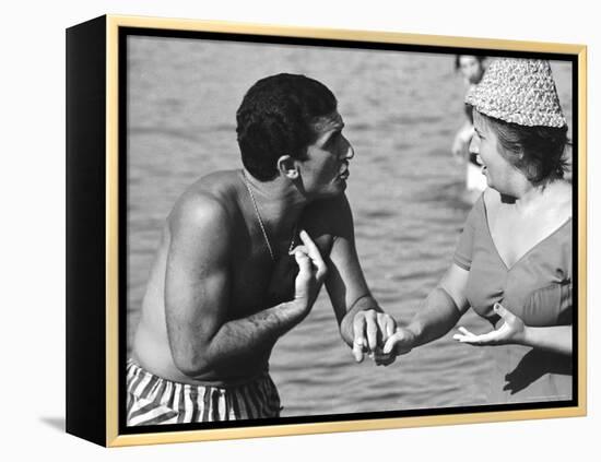 Italian Man Talking to a Woman While Enjoying a Day at the Beach-Paul Schutzer-Framed Premier Image Canvas