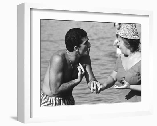 Italian Man Talking to a Woman While Enjoying a Day at the Beach-Paul Schutzer-Framed Photographic Print