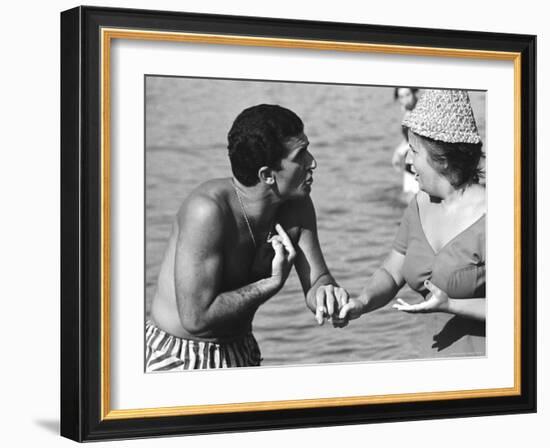 Italian Man Talking to a Woman While Enjoying a Day at the Beach-Paul Schutzer-Framed Photographic Print