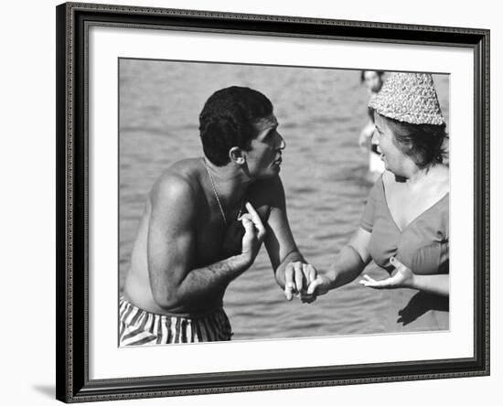 Italian Man Talking to a Woman While Enjoying a Day at the Beach-Paul Schutzer-Framed Photographic Print