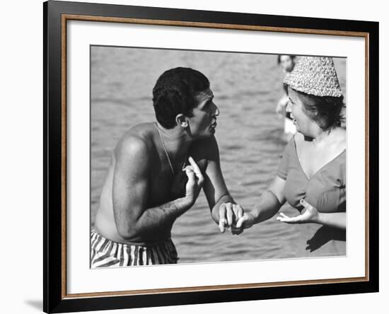 Italian Man Talking to a Woman While Enjoying a Day at the Beach-Paul Schutzer-Framed Photographic Print