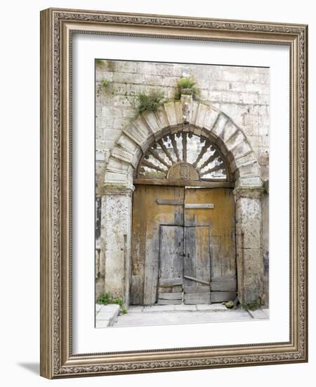 Italy, Basilicata, Matera. Old ornate wooden door in the old town of Matera.-Julie Eggers-Framed Photographic Print