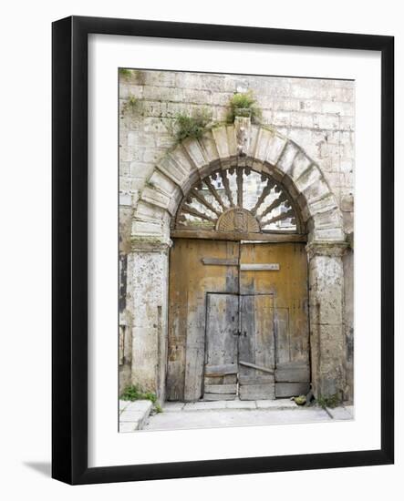 Italy, Basilicata, Matera. Old ornate wooden door in the old town of Matera.-Julie Eggers-Framed Photographic Print
