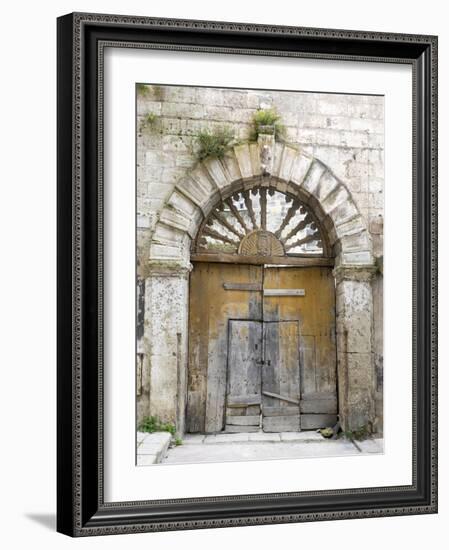 Italy, Basilicata, Matera. Old ornate wooden door in the old town of Matera.-Julie Eggers-Framed Photographic Print