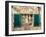 Italy, Chianti, Monteriggioni. Barred window with shutters, wine bottles and planter.-Julie Eggers-Framed Photographic Print