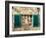 Italy, Chianti, Monteriggioni. Barred window with shutters, wine bottles and planter.-Julie Eggers-Framed Photographic Print