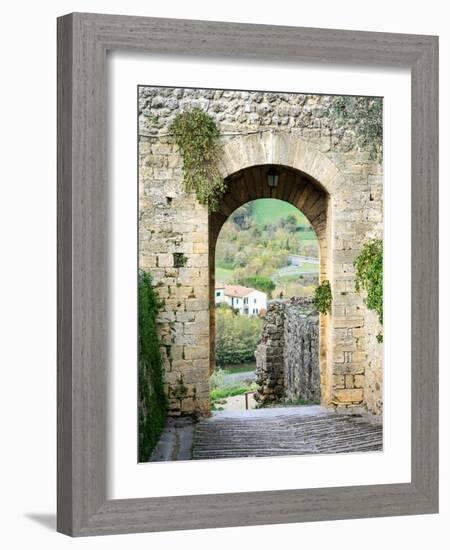 Italy, Chianti, Monteriggioni. Looking out an arched entrance into the walled town.-Julie Eggers-Framed Photographic Print