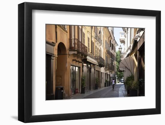 Italy, Lombardy, Cremona, cobblestone street with bicycles and old buildings-Alan Klehr-Framed Photographic Print