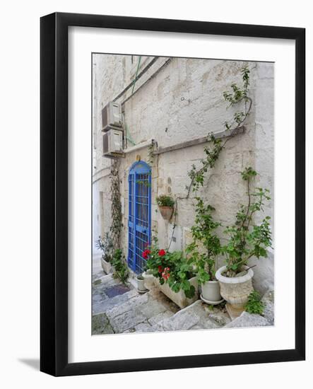 Italy, Puglia, Brindisi, Itria Valley, Ostuni. Blue door and potted plants in old town.-Julie Eggers-Framed Photographic Print