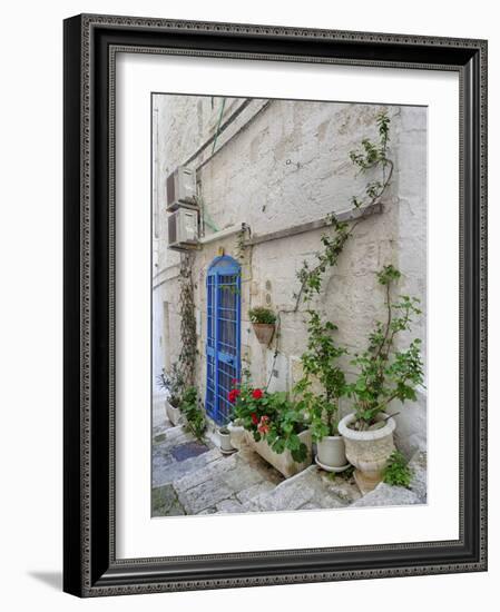 Italy, Puglia, Brindisi, Itria Valley, Ostuni. Blue door and potted plants in old town.-Julie Eggers-Framed Photographic Print