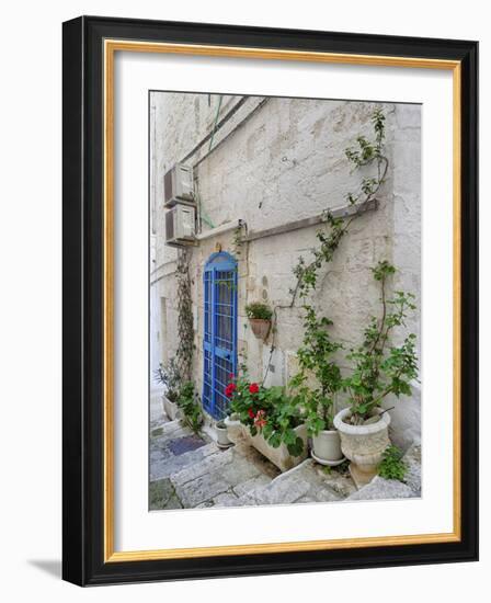 Italy, Puglia, Brindisi, Itria Valley, Ostuni. Blue door and potted plants in old town.-Julie Eggers-Framed Photographic Print