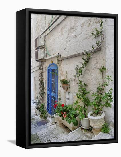 Italy, Puglia, Brindisi, Itria Valley, Ostuni. Blue door and potted plants in old town.-Julie Eggers-Framed Premier Image Canvas