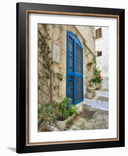 Italy, Puglia, Brindisi, Itria Valley, Ostuni. Blue door and potted plants in old town.-Julie Eggers-Framed Photographic Print