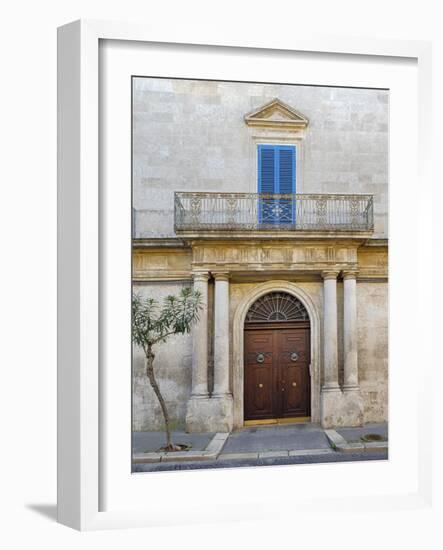 Italy, Puglia, Brindisi, Itria Valley, Ostuni. Wooden door with balcony above and blue shutters.-Julie Eggers-Framed Photographic Print