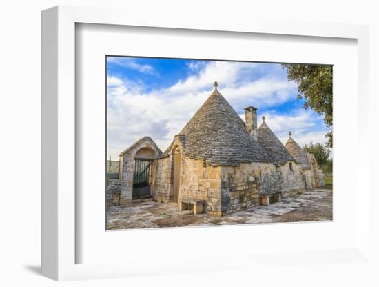 Italy, Region of Apulia, Province of Bari, Itria Valley, Alberobello. A trullo house-Emily Wilson-Framed Photographic Print