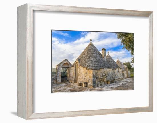 Italy, Region of Apulia, Province of Bari, Itria Valley, Alberobello. A trullo house-Emily Wilson-Framed Photographic Print