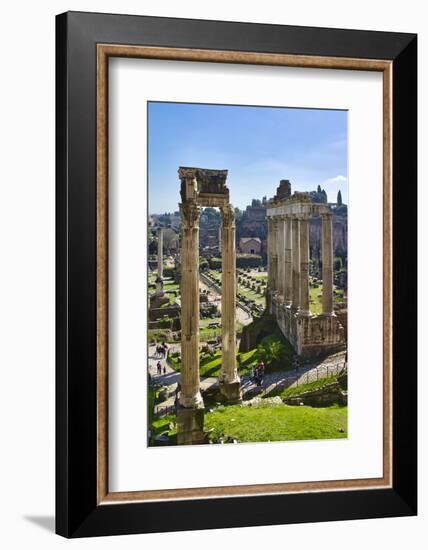 Italy, Rome, temple and arch ruins at Roman Forum-Michele Molinari-Framed Photographic Print