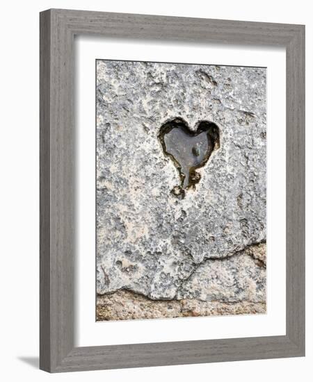 Italy, Tuscany, Chiusure. A carving of a heart in a stone walkway.-Julie Eggers-Framed Photographic Print