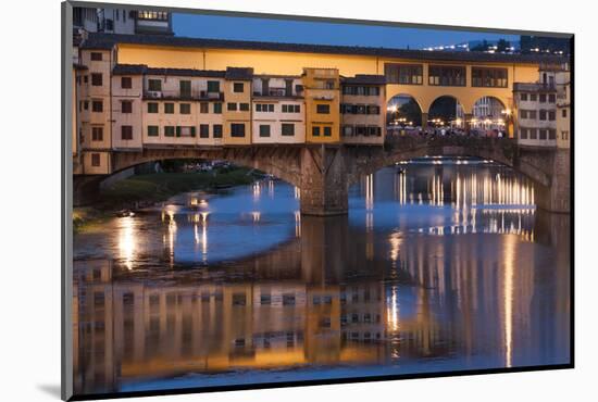Italy, Tuscany, Florence, Ponte Vecchio reflected in Arno River at dusk.-Merrill Images-Mounted Photographic Print