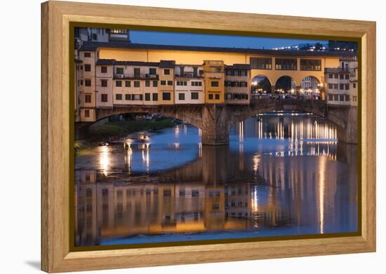 Italy, Tuscany, Florence, Ponte Vecchio reflected in Arno River at dusk.-Merrill Images-Framed Premier Image Canvas