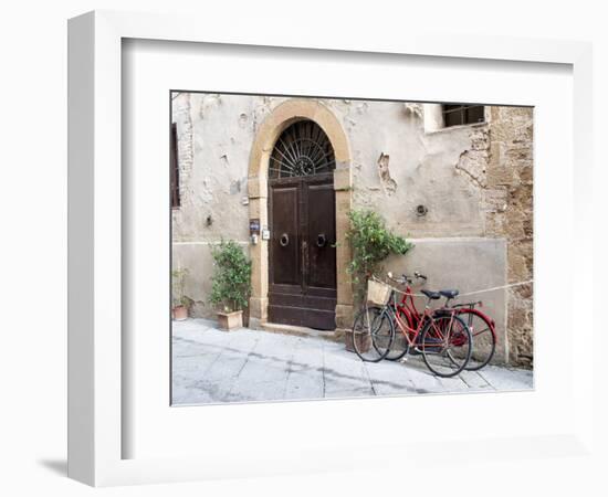 Italy, Tuscany, Pienza. Bicycles Parked Along the Streets of Pienza-Julie Eggers-Framed Photographic Print