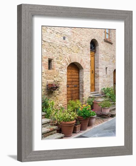 Italy, Tuscany, Pienza. Doorway surrounded by flowers.-Julie Eggers-Framed Photographic Print