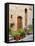 Italy, Tuscany, Pienza. Doorway surrounded by flowers.-Julie Eggers-Framed Premier Image Canvas