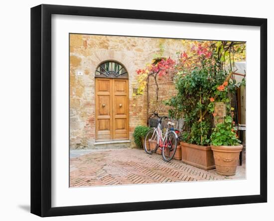 Italy, Tuscany, Pienza. Doorway surrounded by flowers.-Julie Eggers-Framed Photographic Print