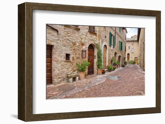 Italy, Tuscany, Pienza. Flower pots and potted plants decorate a narrow street in a Tuscany-Julie Eggers-Framed Photographic Print