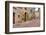 Italy, Tuscany, Pienza. Flower pots and potted plants decorate a narrow street in a Tuscany-Julie Eggers-Framed Photographic Print