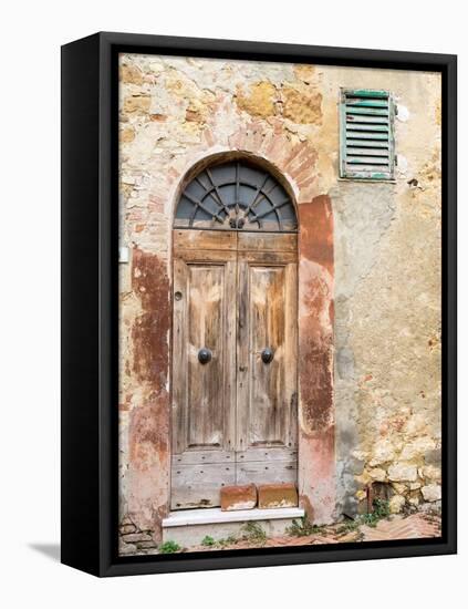 Italy, Tuscany, Pienza. Old wooden door along the streets.-Julie Eggers-Framed Premier Image Canvas