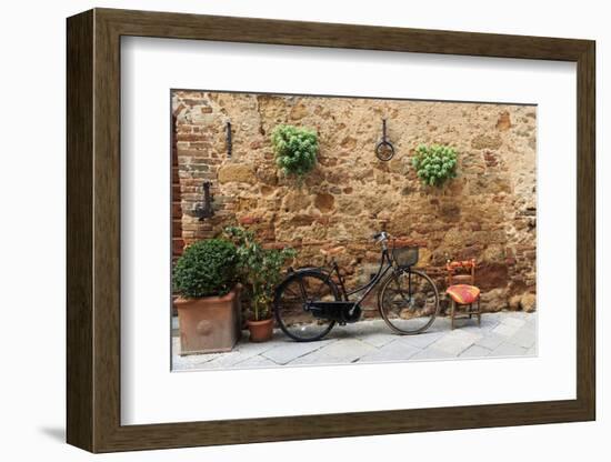 Italy, Tuscany, province of Siena, Chiusure. Hill town. Bicycle leans against stone wall.-Emily Wilson-Framed Photographic Print