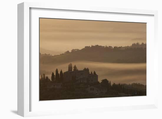 Italy, Tuscany, San Gimignano, farmhouses on ridges with fog at dawn.-Merrill Images-Framed Photographic Print