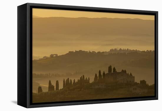 Italy, Tuscany, San Gimignano, farmhouses on ridges with fog at dawn.-Merrill Images-Framed Premier Image Canvas