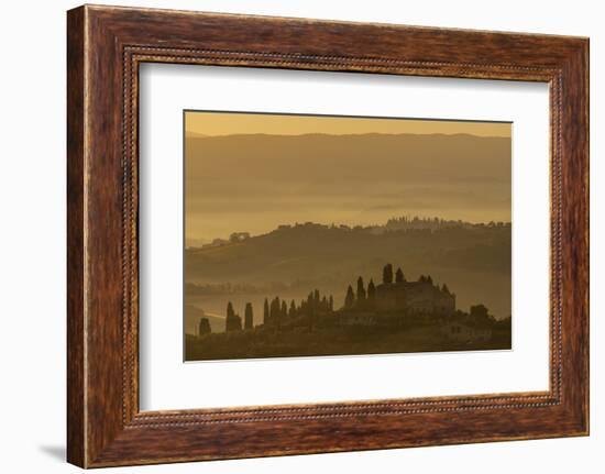 Italy, Tuscany, San Gimignano, farmhouses on ridges with fog at dawn.-Merrill Images-Framed Photographic Print