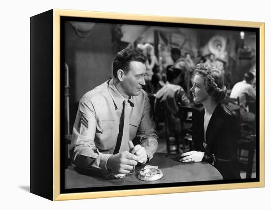 Iwo Jima Sands of Iwo Jima by AllanDwan with John Wayne and Julie Bishop, 1949 (b/w photo)-null-Framed Stretched Canvas