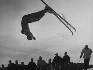 Acrobatic Skier Jack Reddish in Somersault at Sun Valley Ski Resort by J^ R^ Eyerman