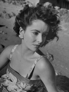 Actress Elizabeth Taylor on the Beach by J^ R^ Eyerman