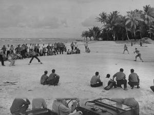 American Servicemen Playing Softball on an Idle Stretch of Runway While Other Soldiers Look On by J^ R^ Eyerman