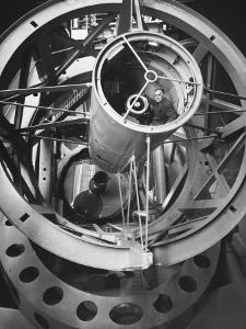 Astronomer Edwin Hubble Pictured Inside the Workings of the Huge 200 In. Mt. Palomar Telescope by J^ R^ Eyerman