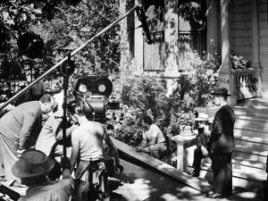 Director Alfred Hitchcock, Bending over to Watch a Rehearsal Through the Camera by J^ R^ Eyerman