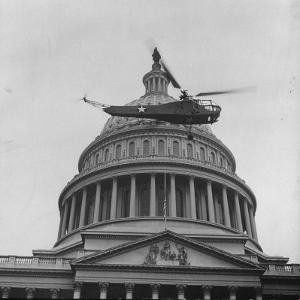 First Successful Us Army Helicopter Designed by Igor Sikorsky Flying Past the Capitol Dome by J^ R^ Eyerman
