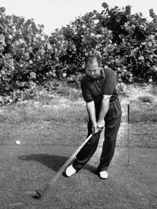 Golfer Claude Harmon Leading with Left Hip as He Hits Ball by J^ R^ Eyerman