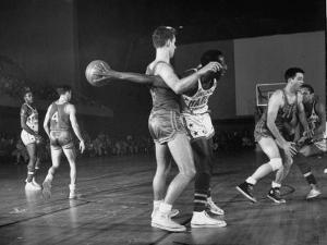 Harlem Globetrotters Playing a Basketball Game by J^ R^ Eyerman