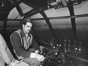 Howard Hughes Sitting at the Controls of His 200 Ton Flying Boat Called the "Spruce Goose" by J^ R^ Eyerman