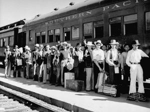 Mexican Farm Workers Boarding Train to Be Taken to Work on Us Farms by J^ R^ Eyerman