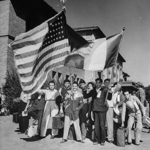Mexican Farm Workers Waving American and Mexican Flags by J^ R^ Eyerman