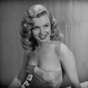 Movie Starlet Marilyn Monroe Posing in Studio by J^ R^ Eyerman