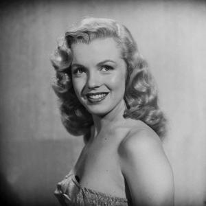 Movie Starlet Marilyn Monroe Posing in Studio by J^ R^ Eyerman