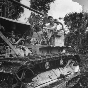 US Navy Seabee Robert H. Sellers of Eugene, or Operating a Caterpiller by J^ R^ Eyerman
